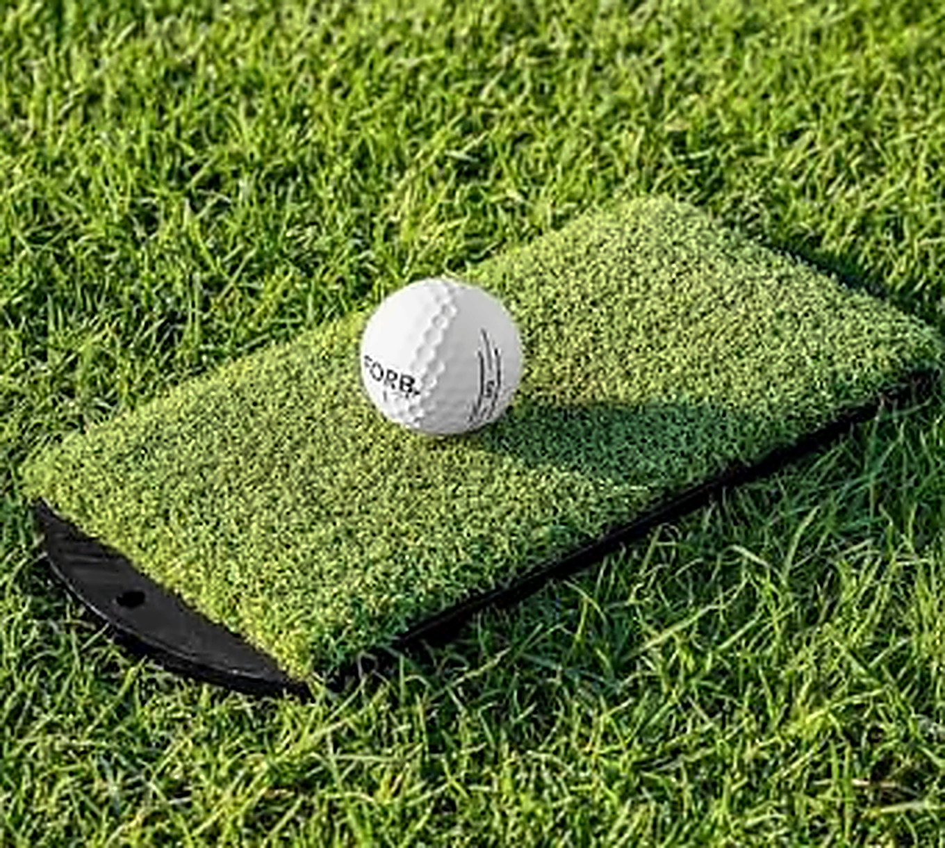 Winter golf mat with a golf ball on the turf at Trentham Park Golf Club, Staffordshire